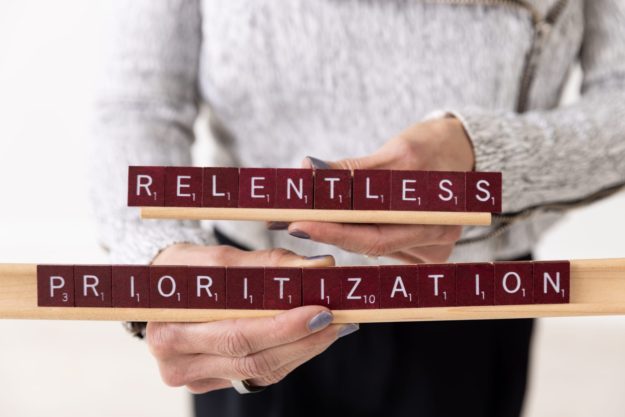 Relentless-Prioritization-Holding Marcey-WWPM-Laptop
